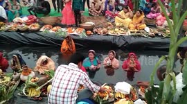 Hundreds of devotees line up in neck-deep water for Hindu festival