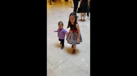 Older sister teaches her 1 year old brother how to walk whole celebrating his birthday