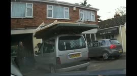 Crazy UK car with 3 fence panels and Ladder  on roof OMG