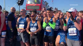 Runners and volunteers prepare for the start of the New York marathon