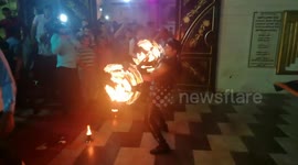Wedding Performer Controls Fire With Metal Instruments