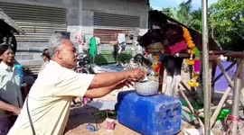 Villagers worship buffalo born with two heads in rural Thailand