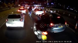 No lights, no helmets, no license plates: Hooded youths on mopeds weave through Manchester traffic on Halloween night, hitting cars