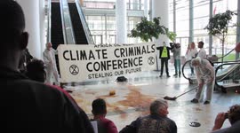 Climate activists stage 'oil spill' at Africa Oil Week conference in Cape Town