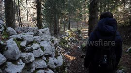 Girl walking in the woods and rocks