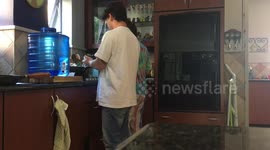 Mom freaks out while cooking with her son!