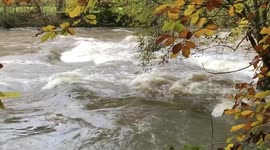 Fast flowing river severn in Newtown Powys after heavy rain.