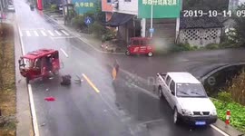 Three-wheeler throws driver out after having collision with car