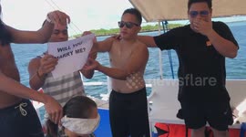 Sweet moment boyfriend makes surprise proposal during party game with friends