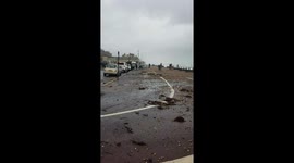 Stones from Hove Beach thrown onto shore road during powerful spring storm