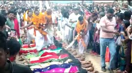 Indian women get stepped on by Hindu holy men in unique ritual to 'fulfil their wishes'