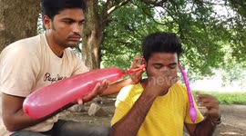 Indian man uses both ears to inflate two 30cm balloons in weird trick