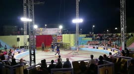 Little Bobsy Dog In Circus Show With Dog Trainer
