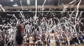 Bizarre tradition sees crowd throw thousands of toilet rolls onto basketball court at US university