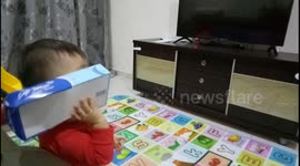 Hilarious footage of a toddler assumed tissuebox as a phone