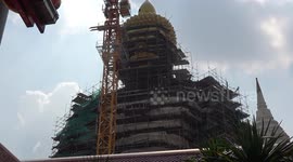 Builders work on 200ft high pure copper Buddha statue in Bangkok