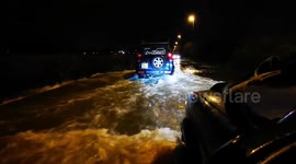 Car in Yorkshire slogs through heavily flooded road