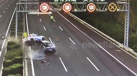 Police officer narrowly escapes injury after out-of-control car smashes into rescue vehicle in China