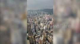 Drone pilot scales high-rise building to capture Hong Kong's spectacular skyline