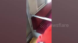 Hundreds of passengers flee train after smoke emerges from the seats