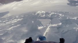 Georgian skier films avalanche escape when slope gives way underneath him