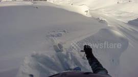Watch this skier escape being sucked into an avalanche on mountain in Georgia