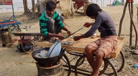 Skilled cook casually whips up Indian pani poori while on the phone