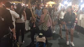 Thai lady dances at the night market in Thailand