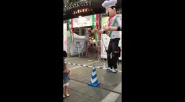 Japanese Pizza Mascot - a person wears a large inflatable mascot that is attached to a backpack
