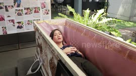 Cafe au lay: Customers LIE IN COFFINS at Thai