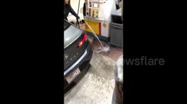 Petrol pump fail! Man laughs hysterically when girlfriend drenches gas station