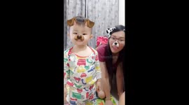 Adorable moment of mom and son playing snapchat dog's tongue filter