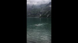 Swimming in the lake of Oeschinensee Kandersteg Switzerland