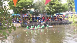 Boat racing on a canal in Thailand.