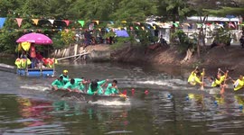 Second day of boat racing in a canal in Thailand.