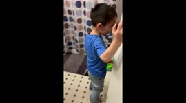 Big Brother is proud of little brother going potty