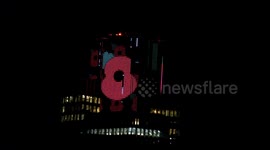 A commemorative display of poppies for Remembrance Sunday appears at the top of Tower 42 in the City of London