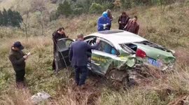 Chinese driver luckily survives after taxi rolls down 100-metre-high cliff