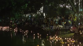 Serene scene during Buddhist ceremony for water goddess in Thailand