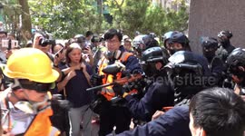 Hong Kong police shoot protesters with pepper spray pellet gun a near point-blank range