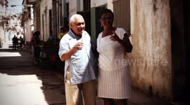 older cuban couple dancing in the street