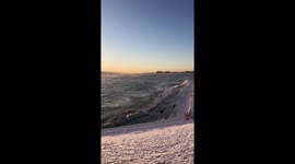 Lake Michigan starts to freeze in Chicago from extreme cold