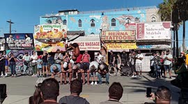 Performer on LA's Venice Beach flips over not one but SIX men