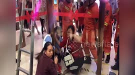 Chinese firemen rescues boy stuck between glass doors