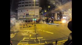 Hong Kong police charge protesters while firing tear gas in Mong Kok