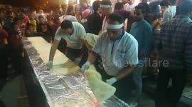 People Gathered Around Restaurant Chefs Preparing Longest Sandwich Shawerma On Street Tables For Black Friday Anniversary