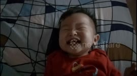 Toddler laughter hysterically when his dad says 'You're So Cute' to him