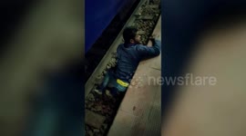 Tipsy man cheats death after falling onto train tracks in central India