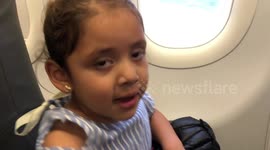 Daughter Praying on the airplane - can you see grandma?