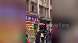 Chinese toddler luckily lands on canopy after falling from first floor of building